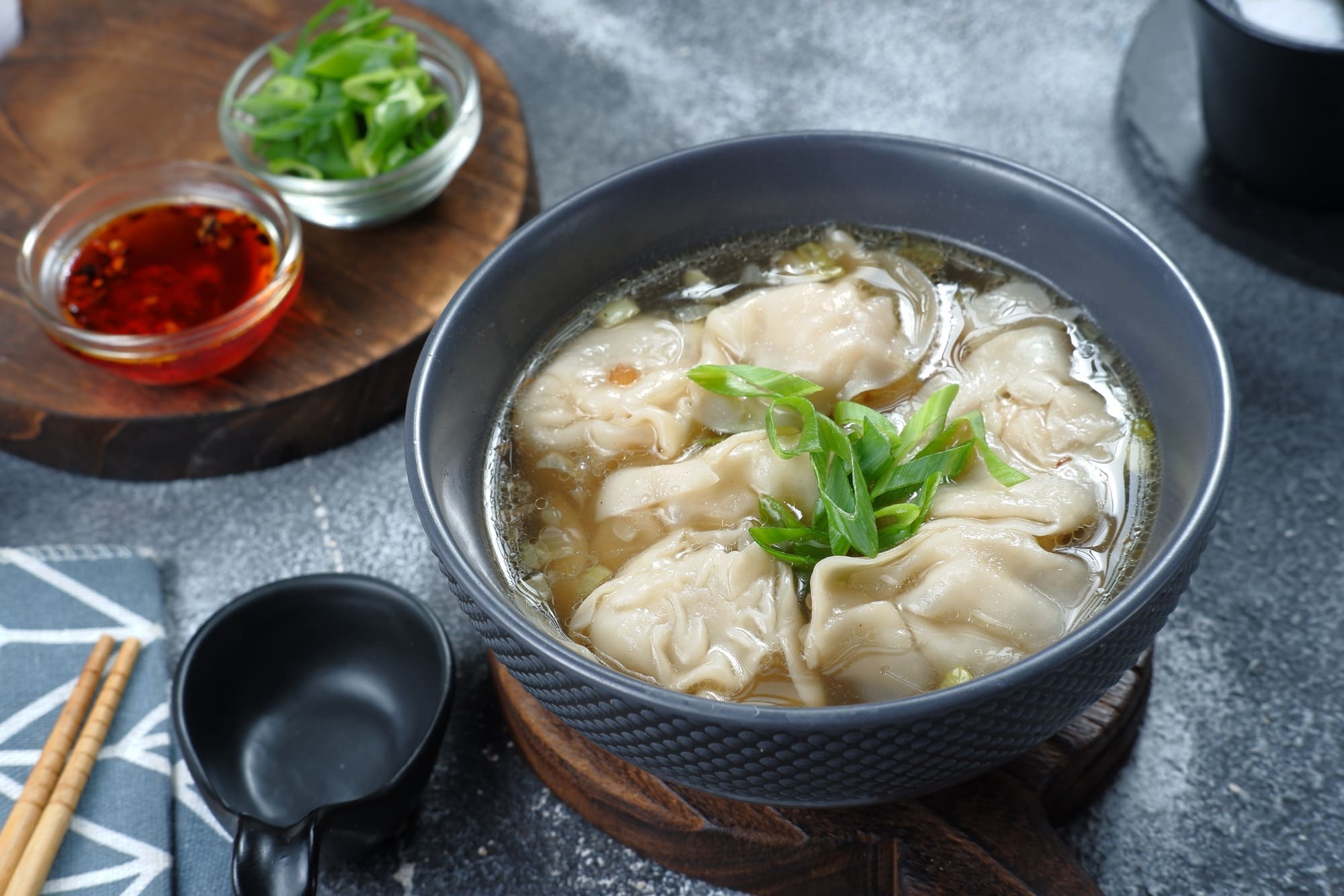 delicious of wonton soup with chili oil and green onion,chinese food,asian food style