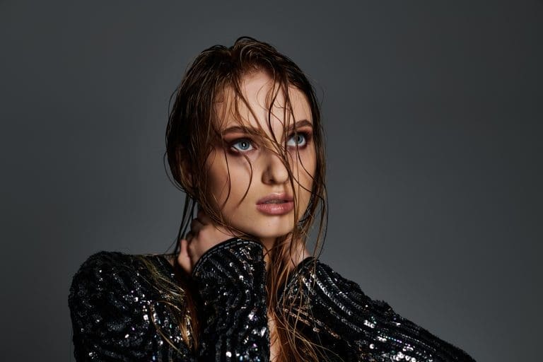 Glistening Beauty: Woman Flaunting Wet Hair