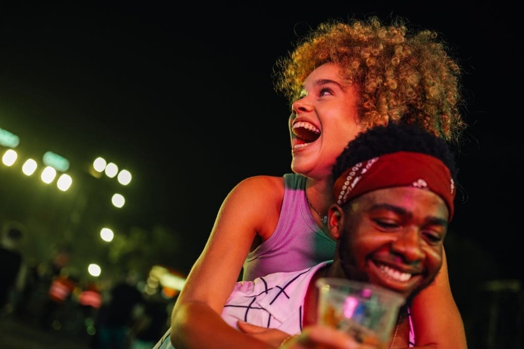 The Best Food Festivals in Quebec in 2025 Joyful friends celebrating at night festival