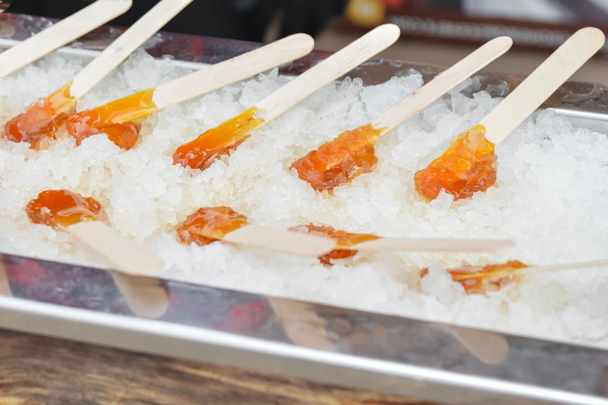 Making maple syrup on a snow. Maple syrup on a stick